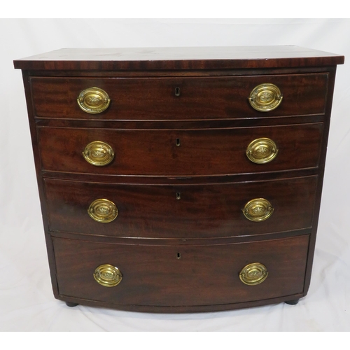 180 - Mahogany bow fronted chest of four drawers with brass drop handles, on bun feet