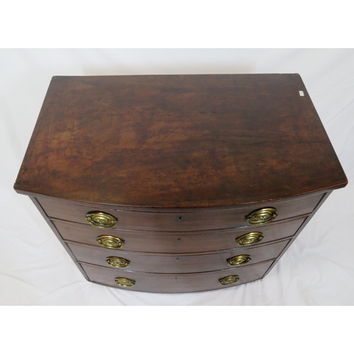 180 - Mahogany bow fronted chest of four drawers with brass drop handles, on bun feet