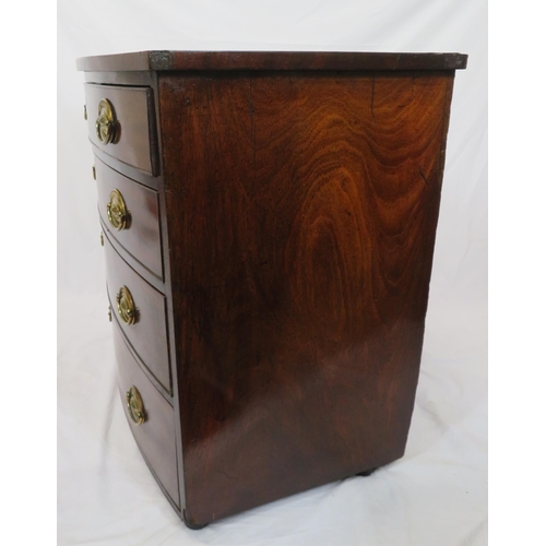 180 - Mahogany bow fronted chest of four drawers with brass drop handles, on bun feet