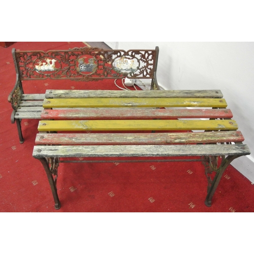 181 - Child's cast iron garden bench and lacquered table with ornate and teddy bear decoration