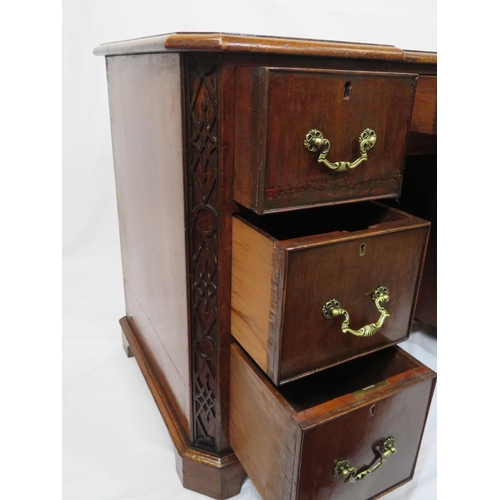 35 - Georgian mahogany front desk with side and one frieze drawer, drop handles, central press, on bracke... 