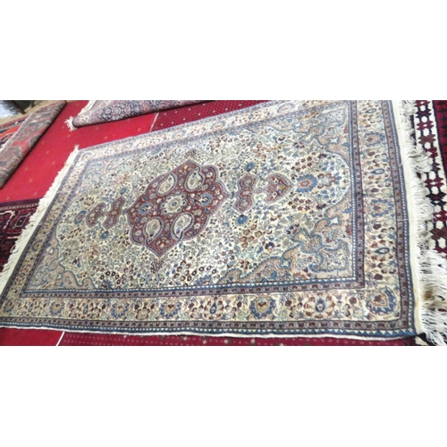 43 - Ivory ground Persian style hearth rug with foliate decoration 220x138cm