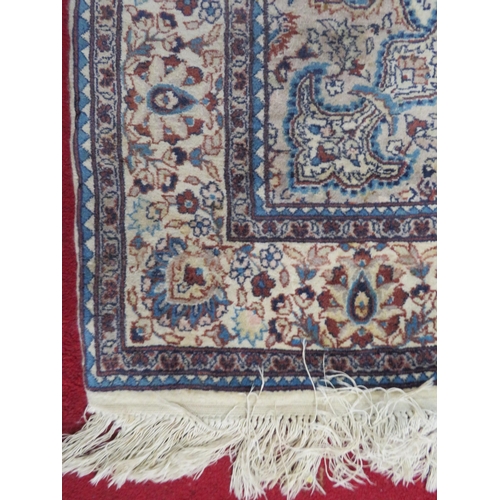 43 - Ivory ground Persian style hearth rug with foliate decoration 220x138cm