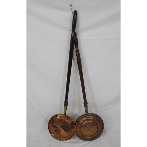 62 - Two Victorian copper round bed warmers with shaped timber handles
