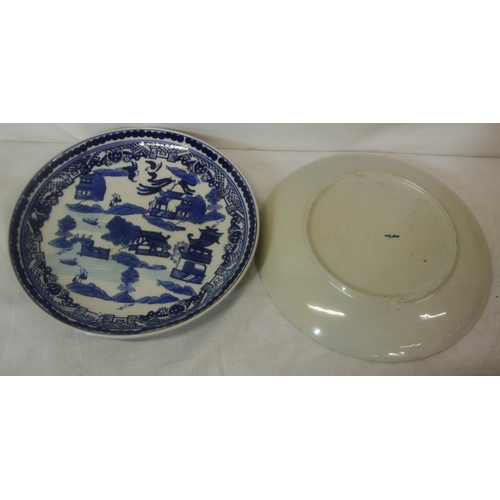 73 - Pair of Oriental style willow pattern round dishes with ornate scenic blue and white decoration