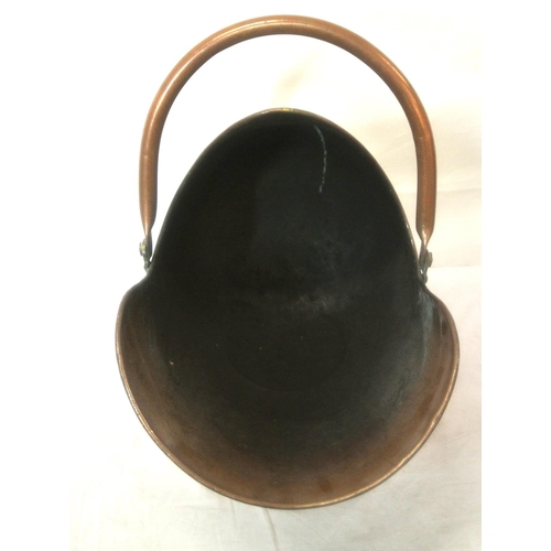 91 - Georgian copper helmet shaped coal scuttle with shaped handle and round base