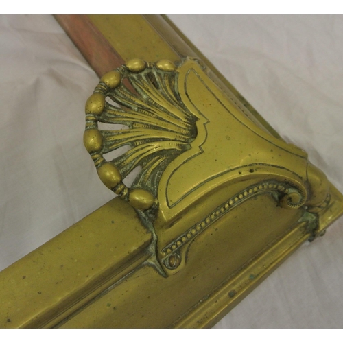 92 - Edwardian brass fire fender with pierced shell decoration