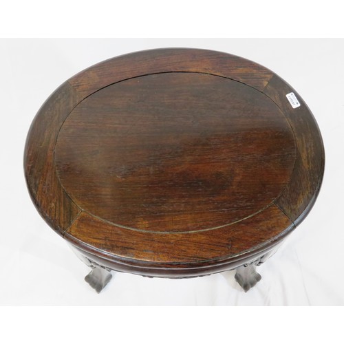 18 - Oriental oval teak stool with foliate and scroll carving
