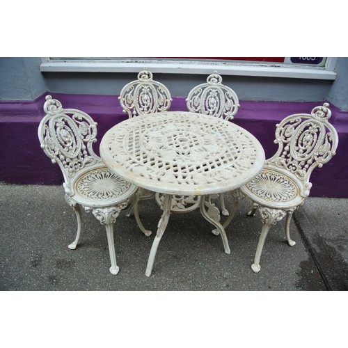 140 - Ornate five piece cast iron garden or patio suite - four chairs and one round table with ornate foli... 