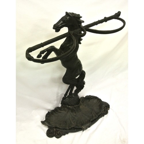 143 - Cast iron umbrella and stick stand with horse shaped column and scroll decorated base