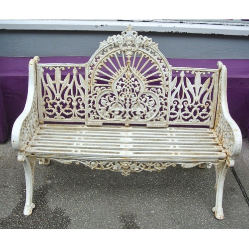 272 - Victorian style cast iron garden seat with domed back, foliate and scroll decoration, shaped legs, s... 