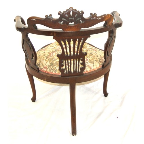 279 - Victorian mahogany tub armchair with scroll decorated pediment, shaped arms, pierced splats, serpent... 