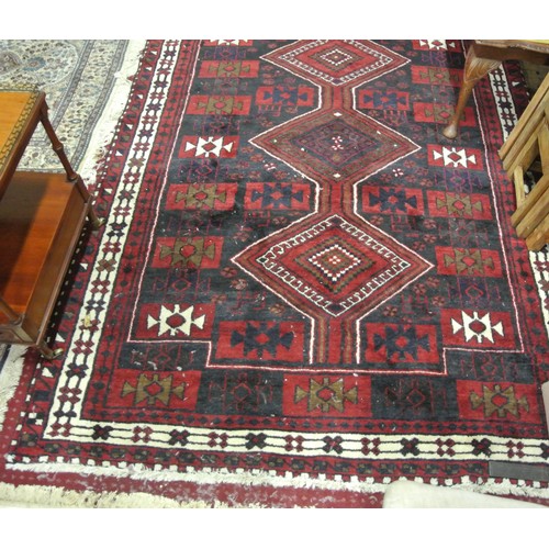 9 - Persian style red ground hearth rug with diamond decoration 245cm x170cm