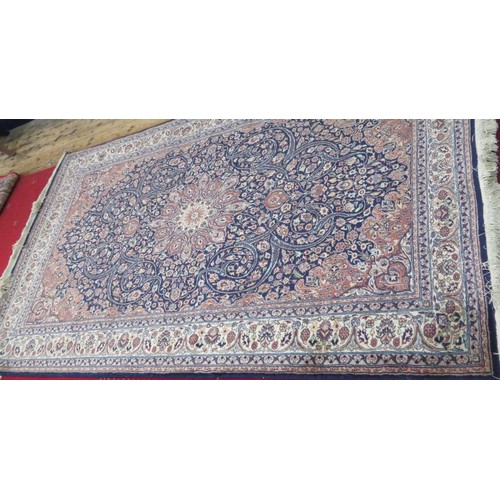 51 - Red ground Persian rug with foliate decoration 230x138cm