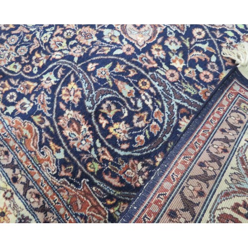 51 - Red ground Persian rug with foliate decoration 230x138cm