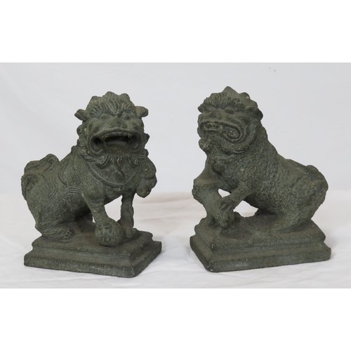 67 - Pair of carved stone Qing Dynasty style foo dogs on stepped bases