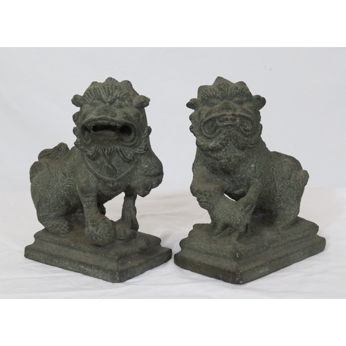 67 - Pair of carved stone Qing Dynasty style foo dogs on stepped bases