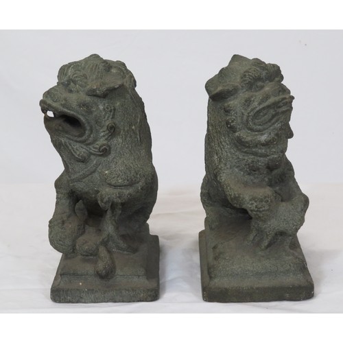 67 - Pair of carved stone Qing Dynasty style foo dogs on stepped bases