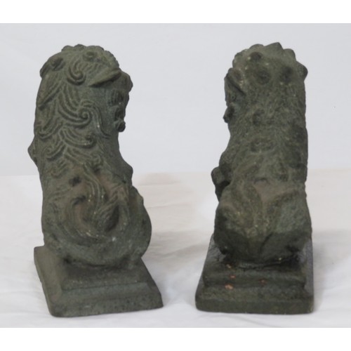 67 - Pair of carved stone Qing Dynasty style foo dogs on stepped bases