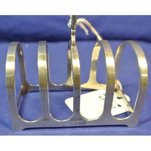 110 - Birmingham silver four section small toast rack of domed form