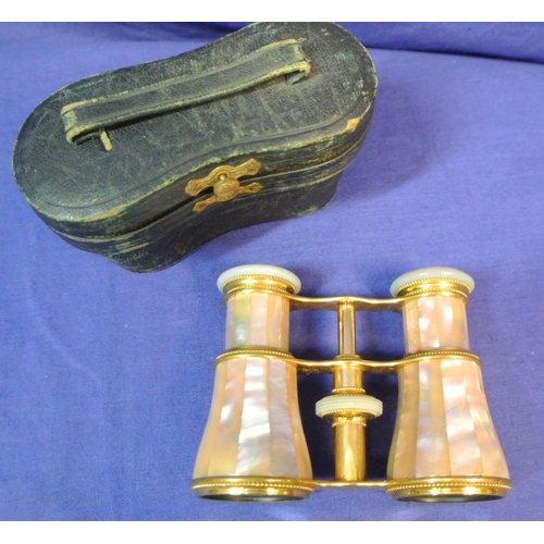 111 - Pair of brass adjustable Opera glasses with ornate Mother of Pearl applied panels, in case