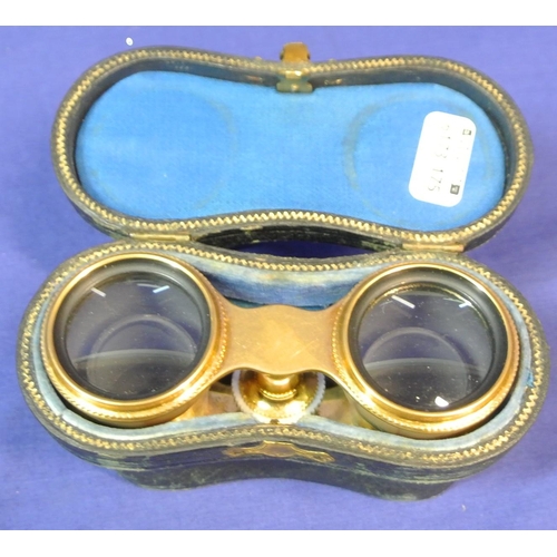 111 - Pair of brass adjustable Opera glasses with ornate Mother of Pearl applied panels, in case