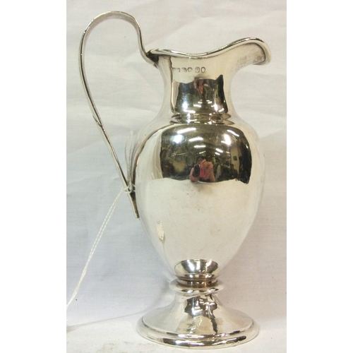 141 - Sheffield silver baluster shaped ewer with reeded shaped handle on circular raised base, 225g