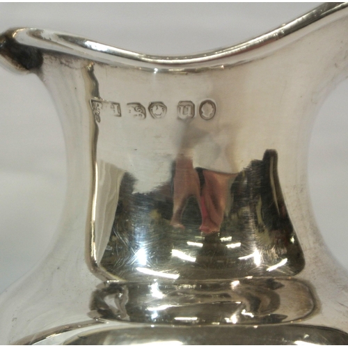 141 - Sheffield silver baluster shaped ewer with reeded shaped handle on circular raised base, 225g