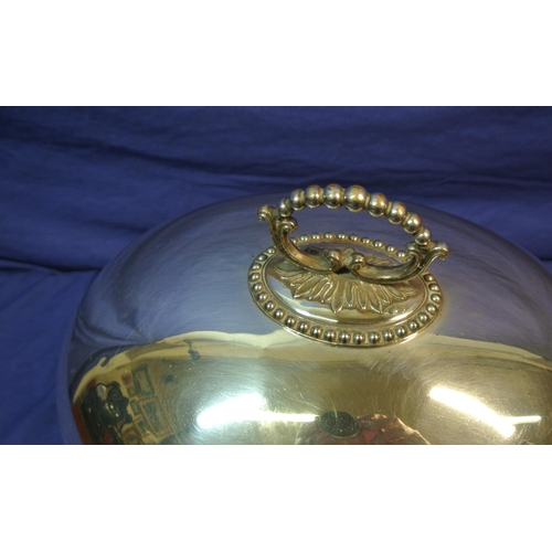 19 - Oval silverplated dish cover with gadroon border and shaped handle