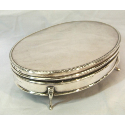 190 - Oval Birmingham silver jewellery box with beaded borders, on four cast legs H6cm x 17X13cm