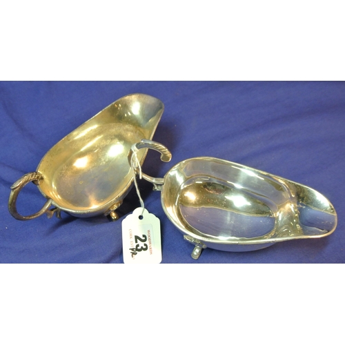 23 - Pair of boat shaped silverplated sauce boats with Celtic rims, S-shaped handles, and hoof feet