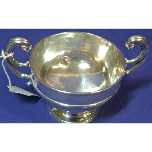 255 - Irish silver two handled bowl with scroll handles, on round base, by William Egan & Sons h10cmx 10.5... 