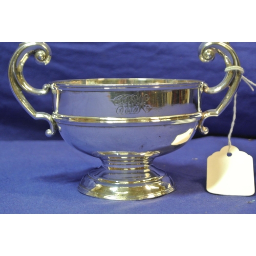 255 - Irish silver two handled bowl with scroll handles, on round base, by William Egan & Sons h10cmx 10.5... 