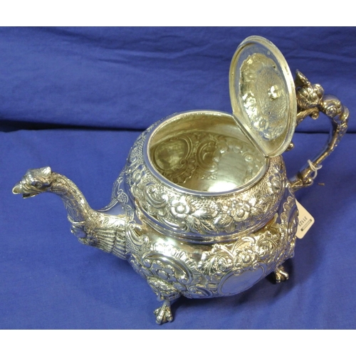 261 - Irish silver George III teapot of double circular form profusely chased and decorated with scrolls a... 