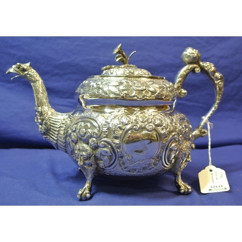 261 - Irish silver George III teapot of double circular form profusely chased and decorated with scrolls a... 