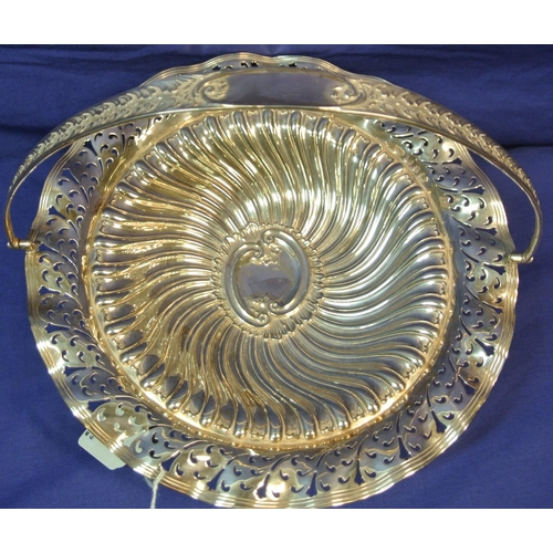 29 - Silverplated cake stand with pierced and foliate decoration and swing handle