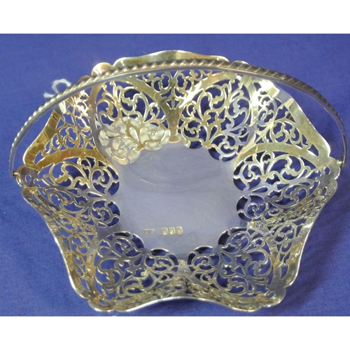 291 - Irish silver bon bon basket with wavy rims, reeded handle and ornate pierced decoration, Dublin, dat... 