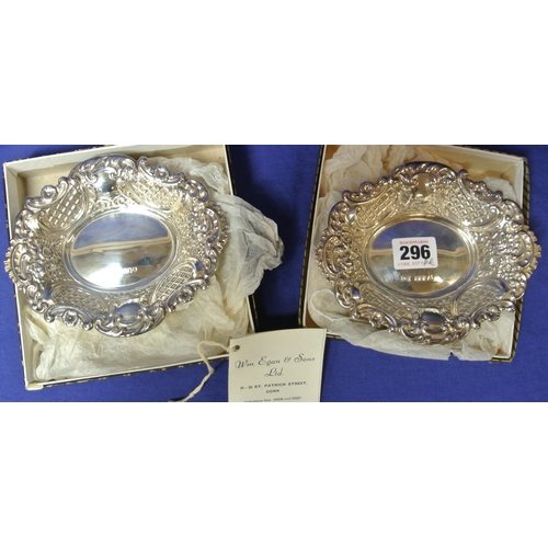 296 - Pair of Cork silver bon bon dishes of serpentine oval shape with ornate foliate lattice and scroll d... 