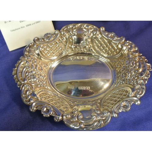 296 - Pair of Cork silver bon bon dishes of serpentine oval shape with ornate foliate lattice and scroll d... 