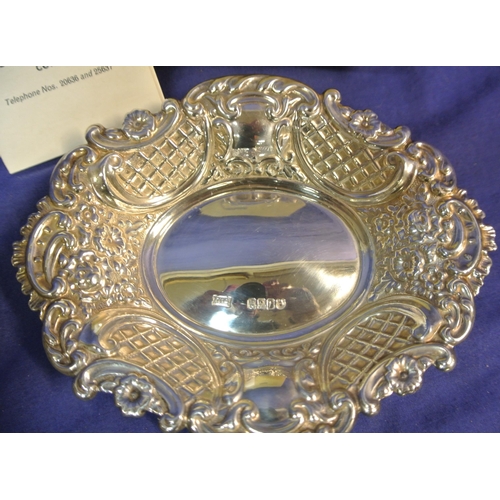 296 - Pair of Cork silver bon bon dishes of serpentine oval shape with ornate foliate lattice and scroll d... 