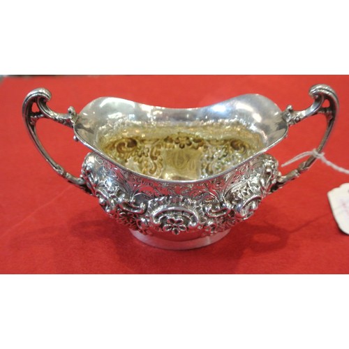 98 - Ornate Sheffield silver oval sugar bowl with wavy rim, ornate scroll and foliate decoration, shaped ... 