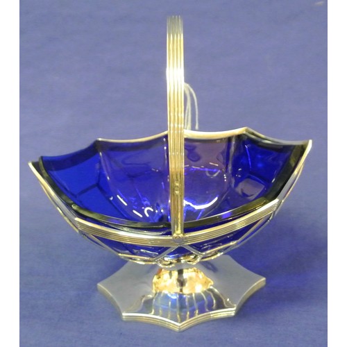 102 - Birmingham silver sugar basket with scalloped borders, shaped blue glass liner, reeded decoration, s... 