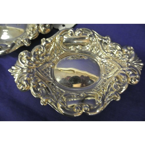 151 - Pair of Birmingham silver oval small dishes with ornate gadroon and scroll decoration, dated 1977, 1... 