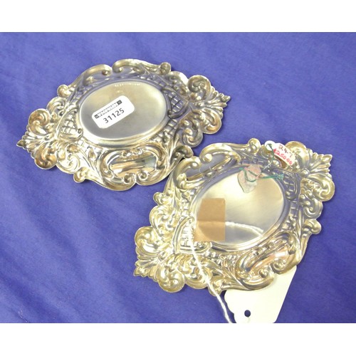 151 - Pair of Birmingham silver oval small dishes with ornate gadroon and scroll decoration, dated 1977, 1... 