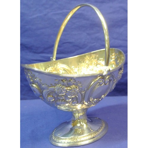 260 - Irish silver George III oval sugar bowl with repousse, scroll and foliate decoration, swing handle, ... 