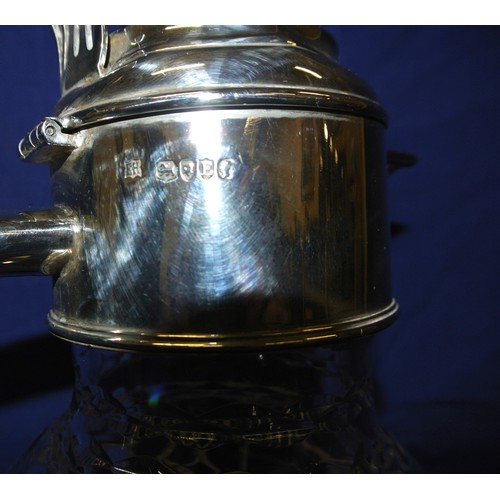 131 - Victorian London silver mounted claret jug, crested lid with thumbpiece, shaped handle and hobnail c... 