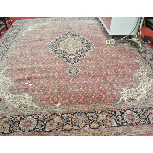 102 - Large terracota ground full wool pile carpet having traditional medallion design 390 X 290cm