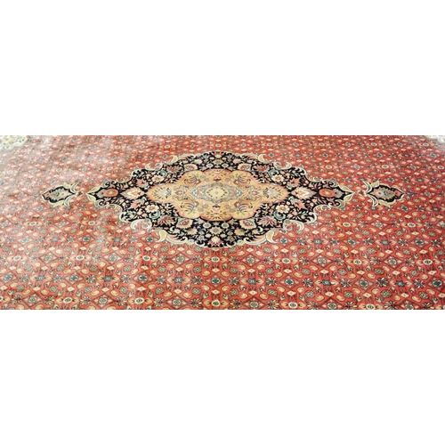 102 - Large terracota ground full wool pile carpet having traditional medallion design 390 X 290cm