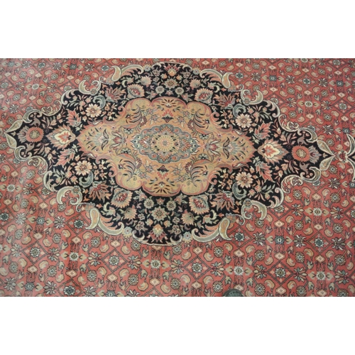 102 - Large terracota ground full wool pile carpet having traditional medallion design 390 X 290cm