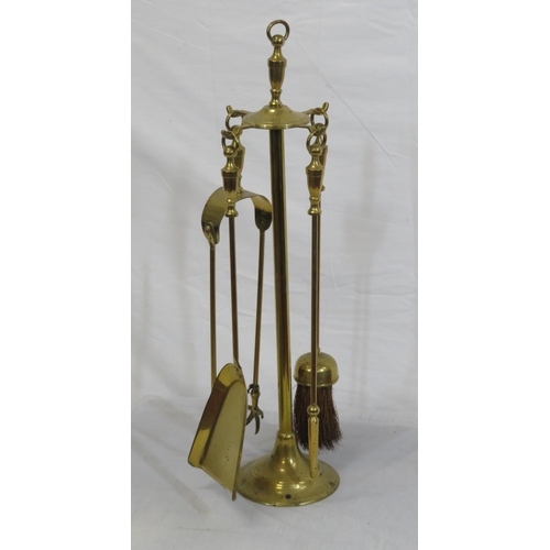 103 - Edwardian style brass four piece companion set on stand